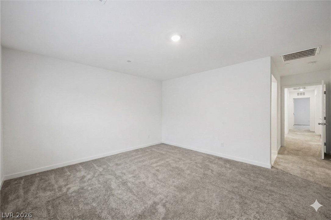 175 Hazel Heights Henderson, NV 89011 - Photo 50 of 55 Empty room featuring light colored carpet and baseboards