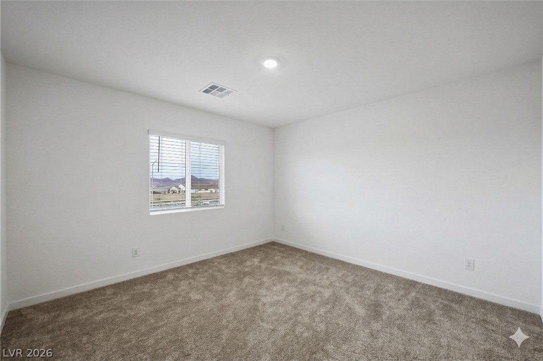175 Hazel Heights Henderson, NV 89011 - Photo 51 of 55 Carpeted empty room featuring baseboards