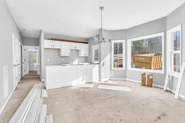 a view of kitchen with furniture and window