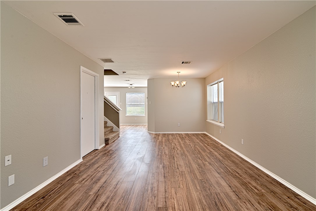 911 Flatters Way Pflugerville, TX 78660 - Photo 1 of 1 a view of a hallway with wooden floor and a window