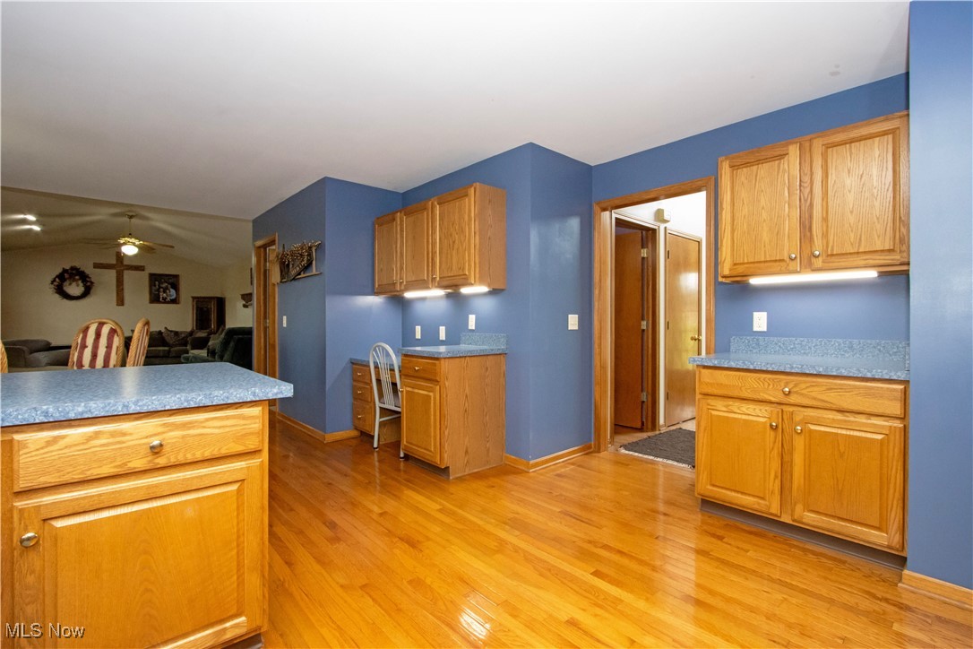 1500 Bell Road Wooster, OH 44691 - Photo 33 of 33 Kitchen with light wood-type flooring, ceiling fan, open floor plan, and baseboards
