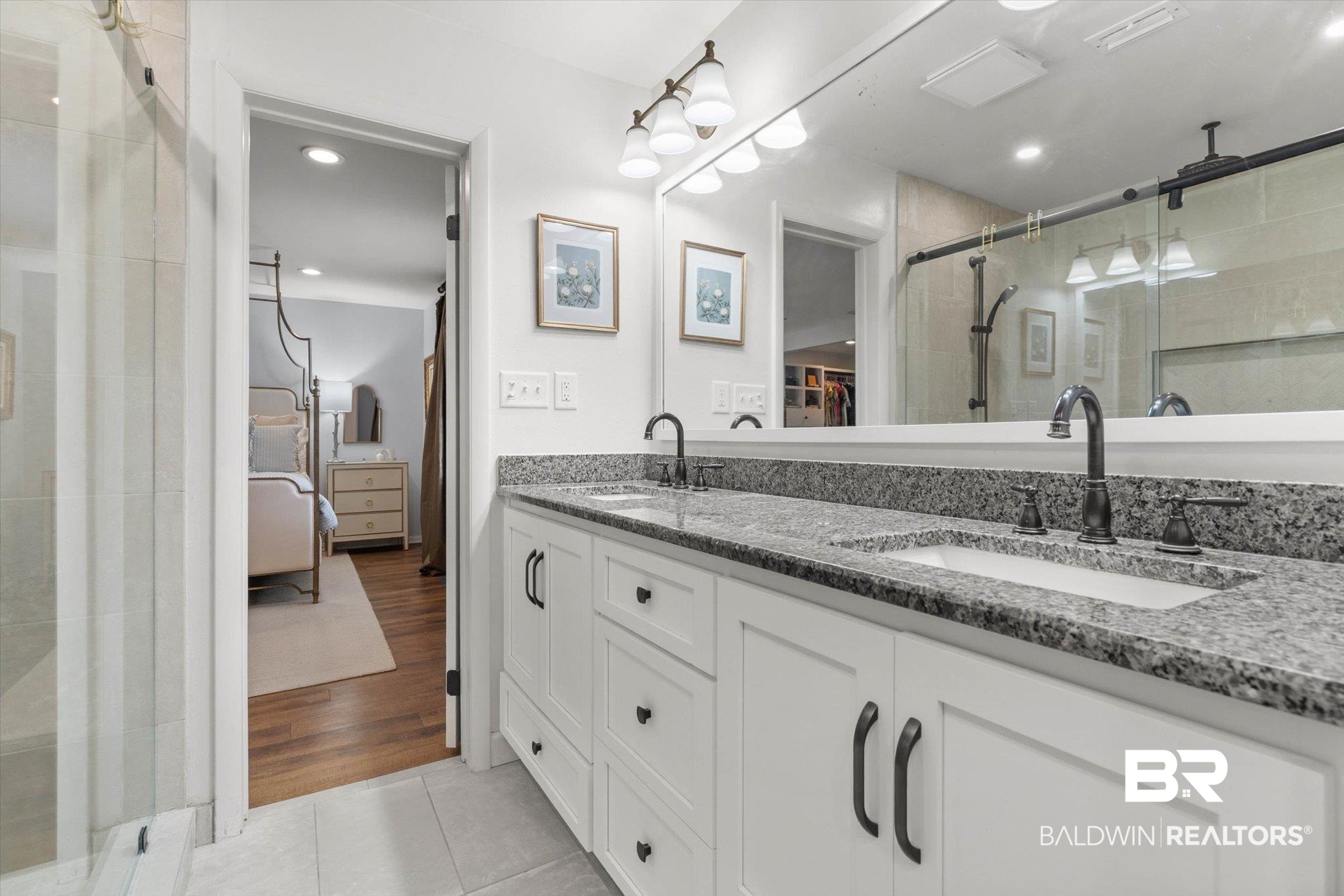 254 Woodlands Avenue Mobile, AL 36607 - Photo 22 of 50 Ensuite bathroom with double vanity, a stall shower, light tile patterned floors, and recessed lighting