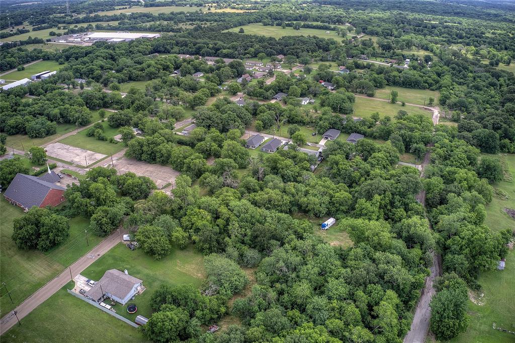 0 Sycamore Street Commerce, TX 75428 - Photo 9 of 14 an aerial view of a house with a yard and lake view