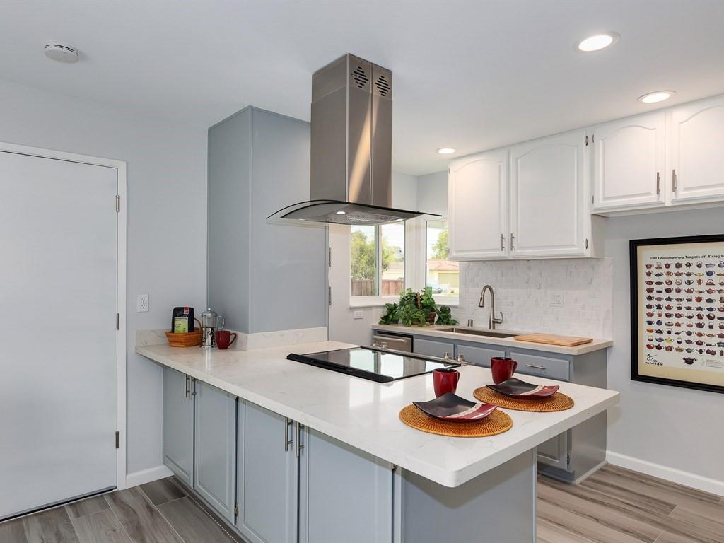 6258 Castillon Drive Newark, CA 94560 - Photo 12 of 20 a kitchen with stainless steel appliances granite countertop a sink and a stove