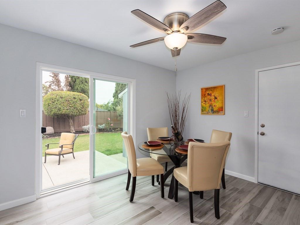6258 Castillon Drive Newark, CA 94560 - Photo 16 of 20 a view of a dining room with furniture window and wooden floor