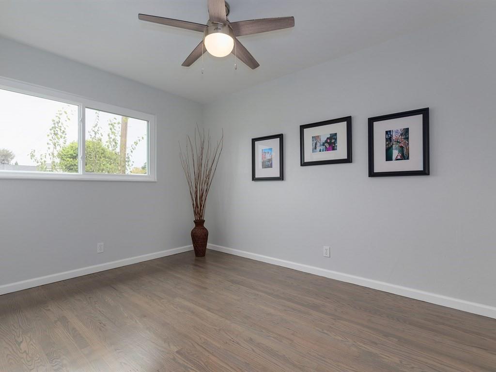 6258 Castillon Drive Newark, CA 94560 - Photo 17 of 20 a view of an empty room with wooden floor and a window