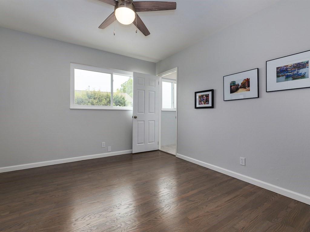 6258 Castillon Drive Newark, CA 94560 - Photo 19 of 20 a view of an empty room with wooden floor and a window