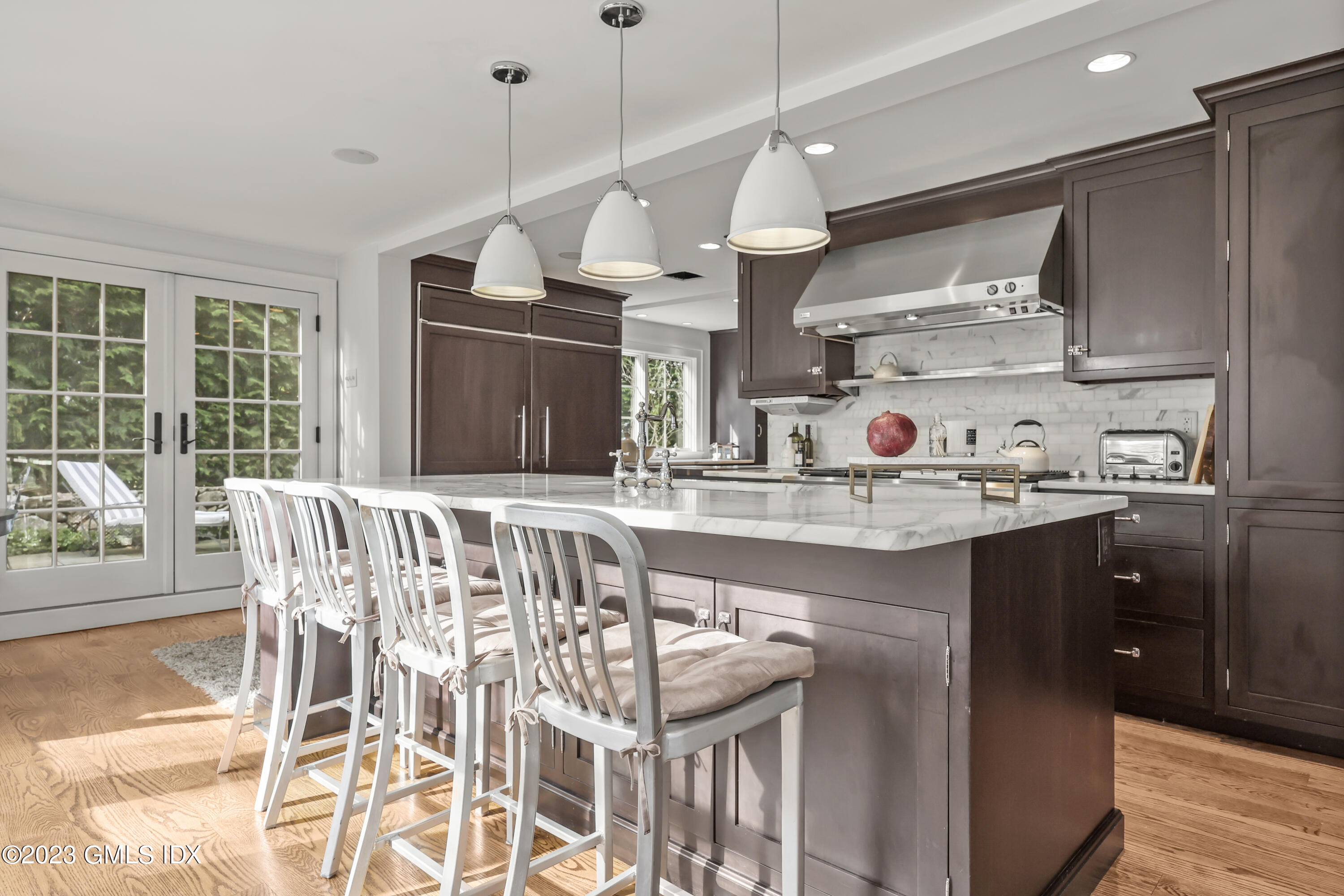 258 Riverside Avenue Riverside, CT 06878 - Photo 5 of 7 a kitchen with stainless steel appliances granite countertop a sink a stove and a refrigerator