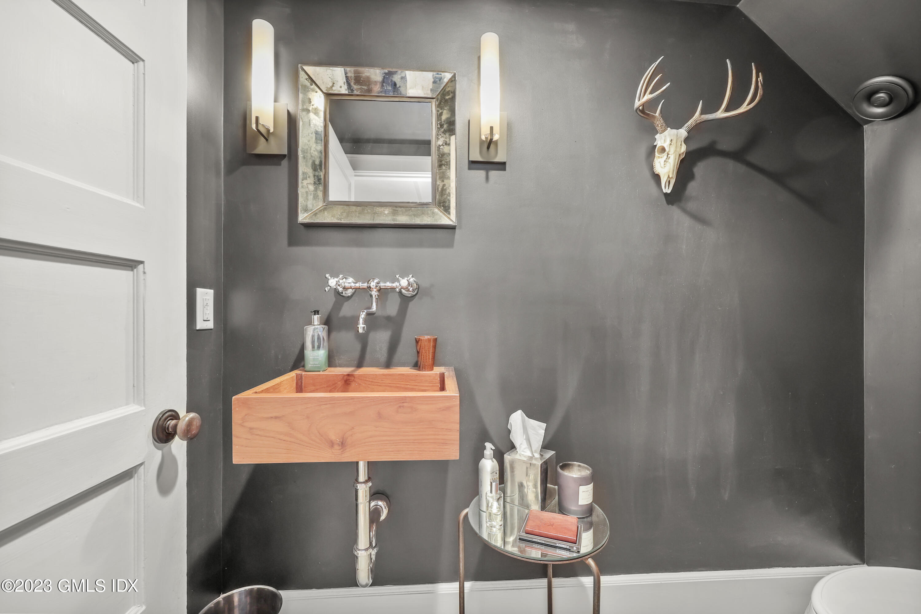 258 Riverside Avenue Riverside, CT 06878 - Photo 7 of 7 a bathroom with a sink mirror and vanity