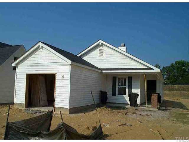 a front view of a house with yard