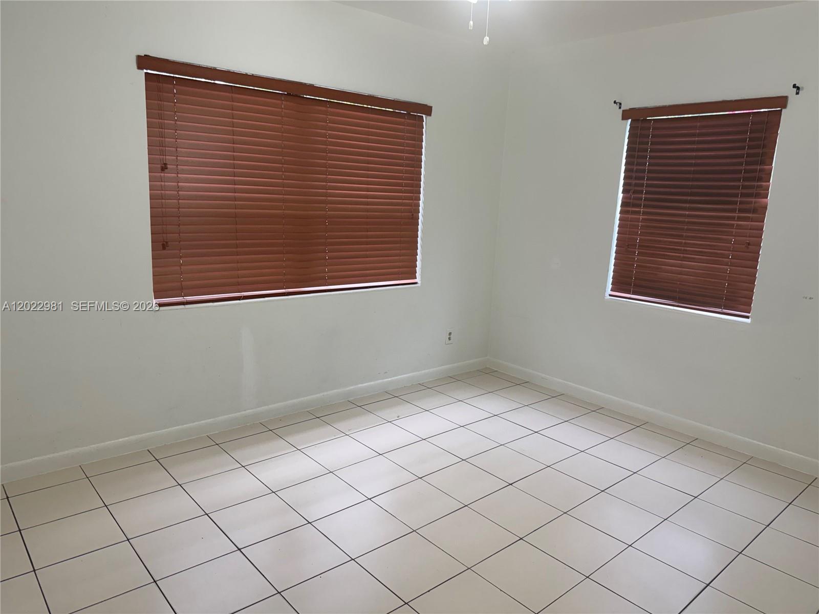 5940 Southwest 2nd Street Miami, FL 33144 - Photo 20 of 22 an empty room with a window