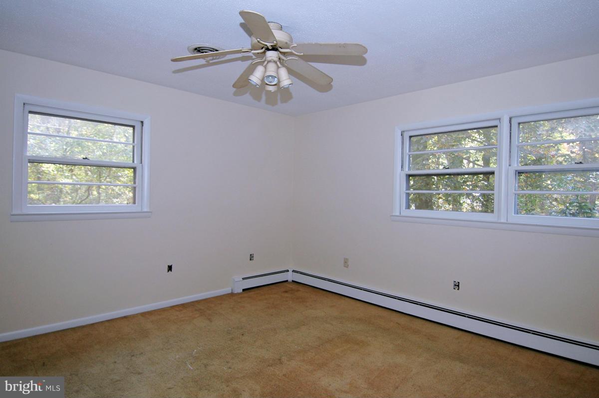 15102 Cactus Hill Road Accokeek, MD 20607 - Photo 14 of 24 a view of an empty room with a window