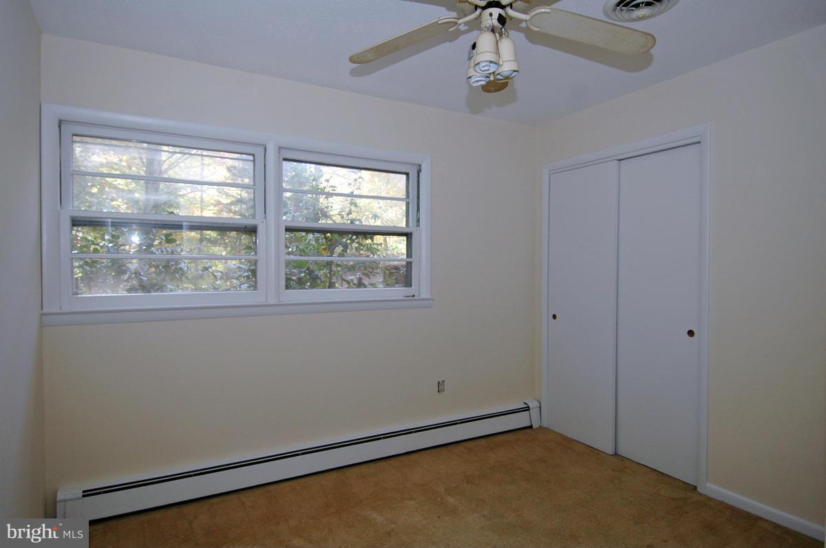 15102 Cactus Hill Road Accokeek, MD 20607 - Photo 15 of 24 a view of an empty room with a window