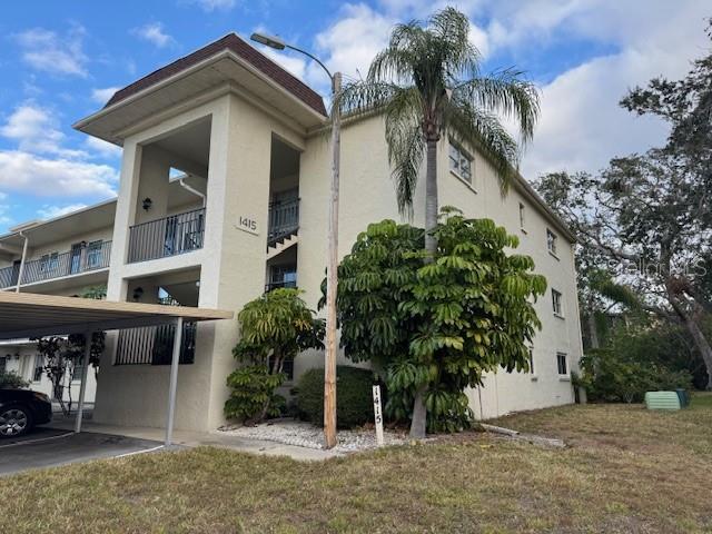 a house that has a tree in front of the house