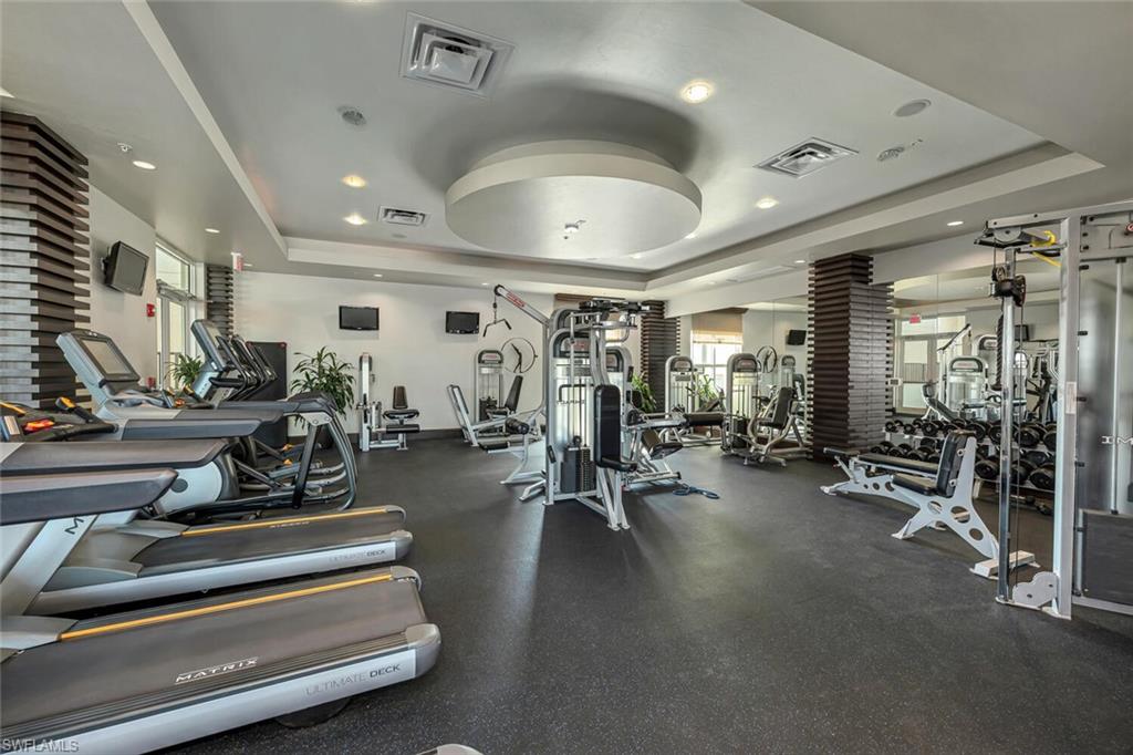 9115 Strada Place, Unit 5505 Naples, FL 34108 - Photo 19 of 44 Workout area featuring a tray ceiling