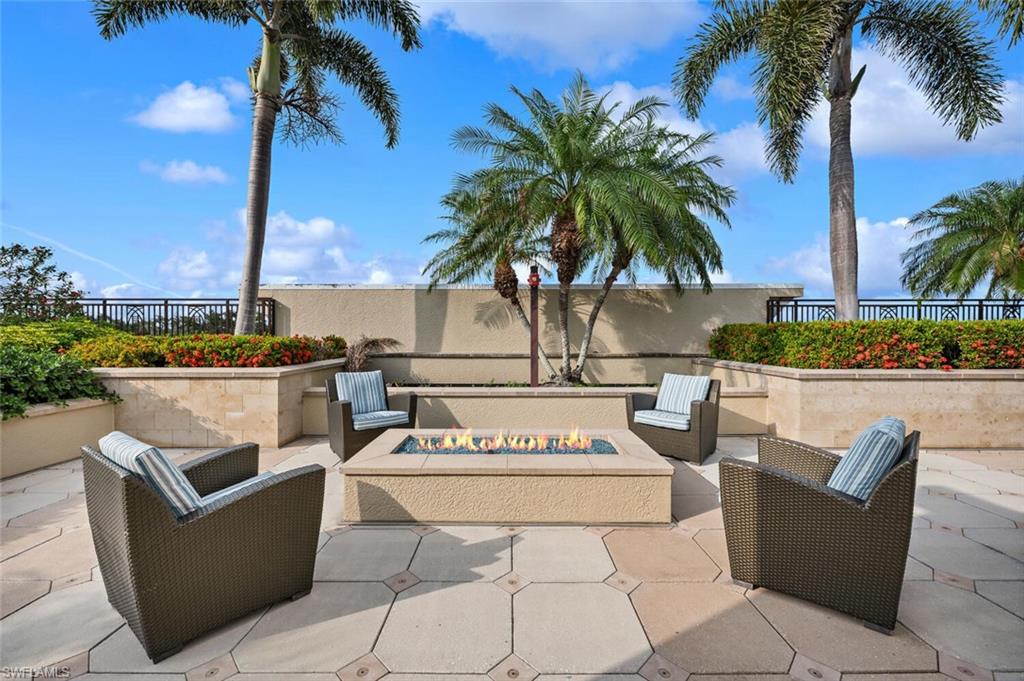 9115 Strada Place, Unit 5505 Naples, FL 34108 - Photo 20 of 44 View of patio with an outdoor fire pit