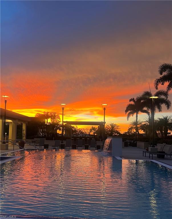 9115 Strada Place, Unit 5505 Naples, FL 34108 - Photo 22 of 44 Pool view at sunset