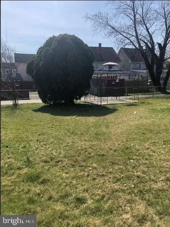 a view of a large body of water with a building in the background