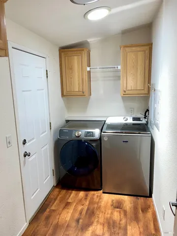a utility room with closet dryer and washer