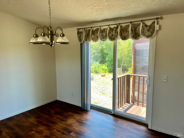 a view of a porch with wooden floor windows and stairs