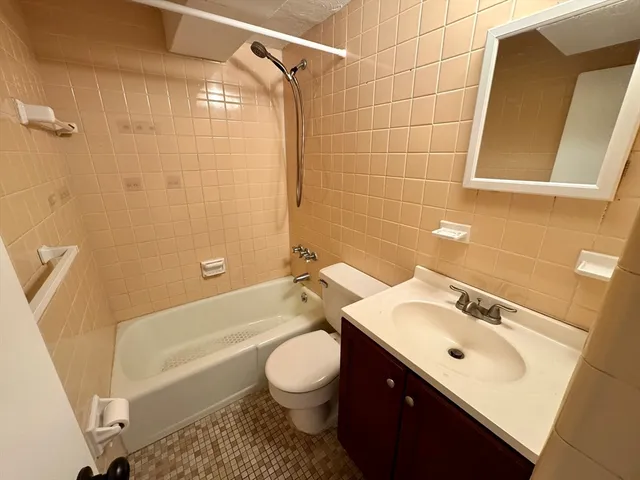 a bathroom with a sink toilet a shower and bathtub