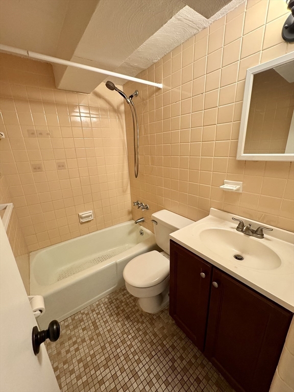 198 Allston Street, Unit 3 Boston, MA 02135 - Photo 8 of 10 a bathroom with a sink toilet a mirror and shower