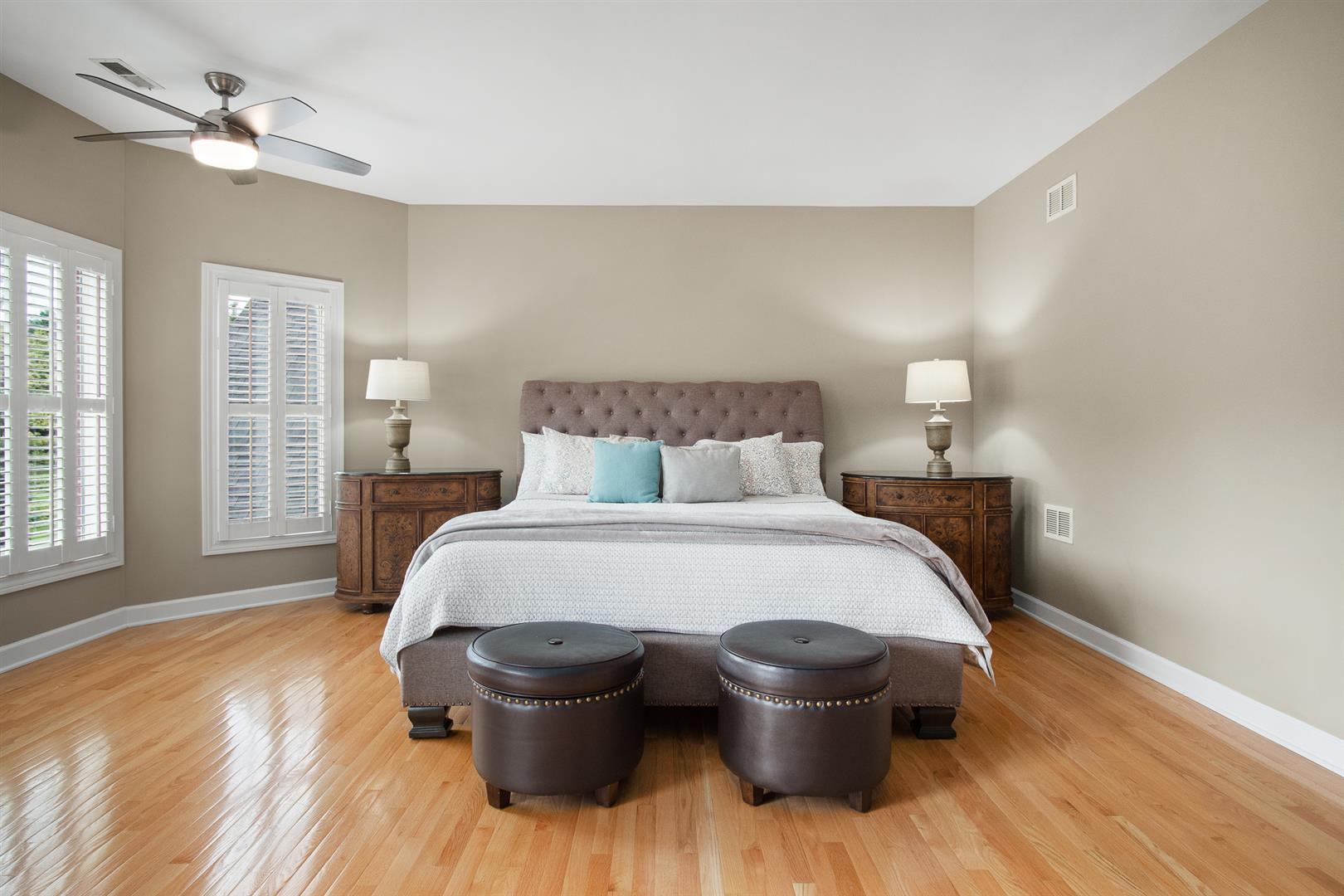 39W385 Woodgate Road St. Charles, IL 60175 - Photo 22 of 43 a bedroom with a bed and wooden floor