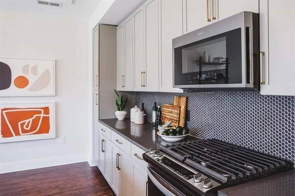 a view of a kitchen and a sink