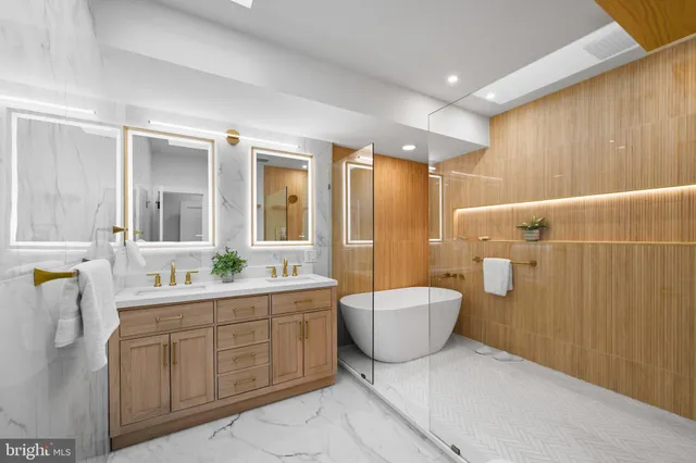 a bathroom with a tub and shower