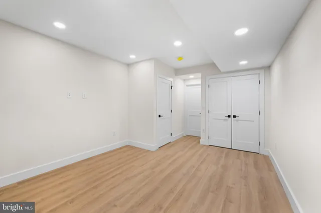 a view of a hallway with a white walls