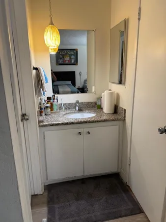 a bathroom with a sink and a mirror