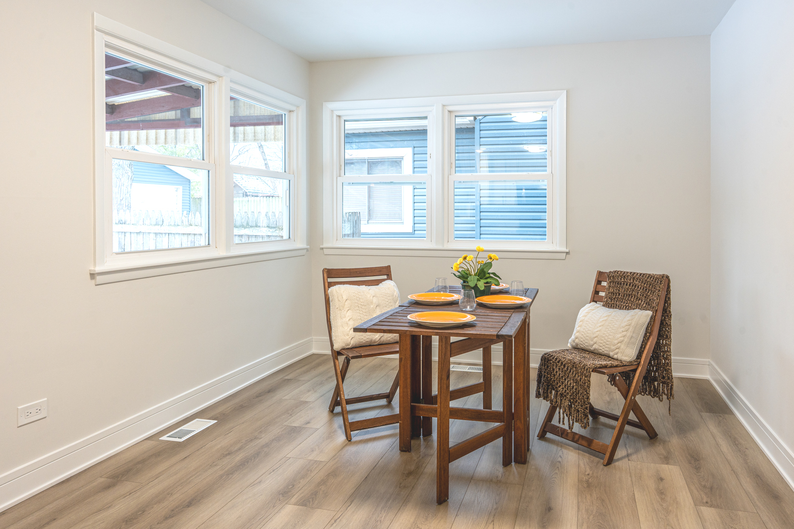 11 South Alfred Avenue Elgin, IL 60123 - Photo 4 of 22 a view of a dining room with furniture wooden floor and a window