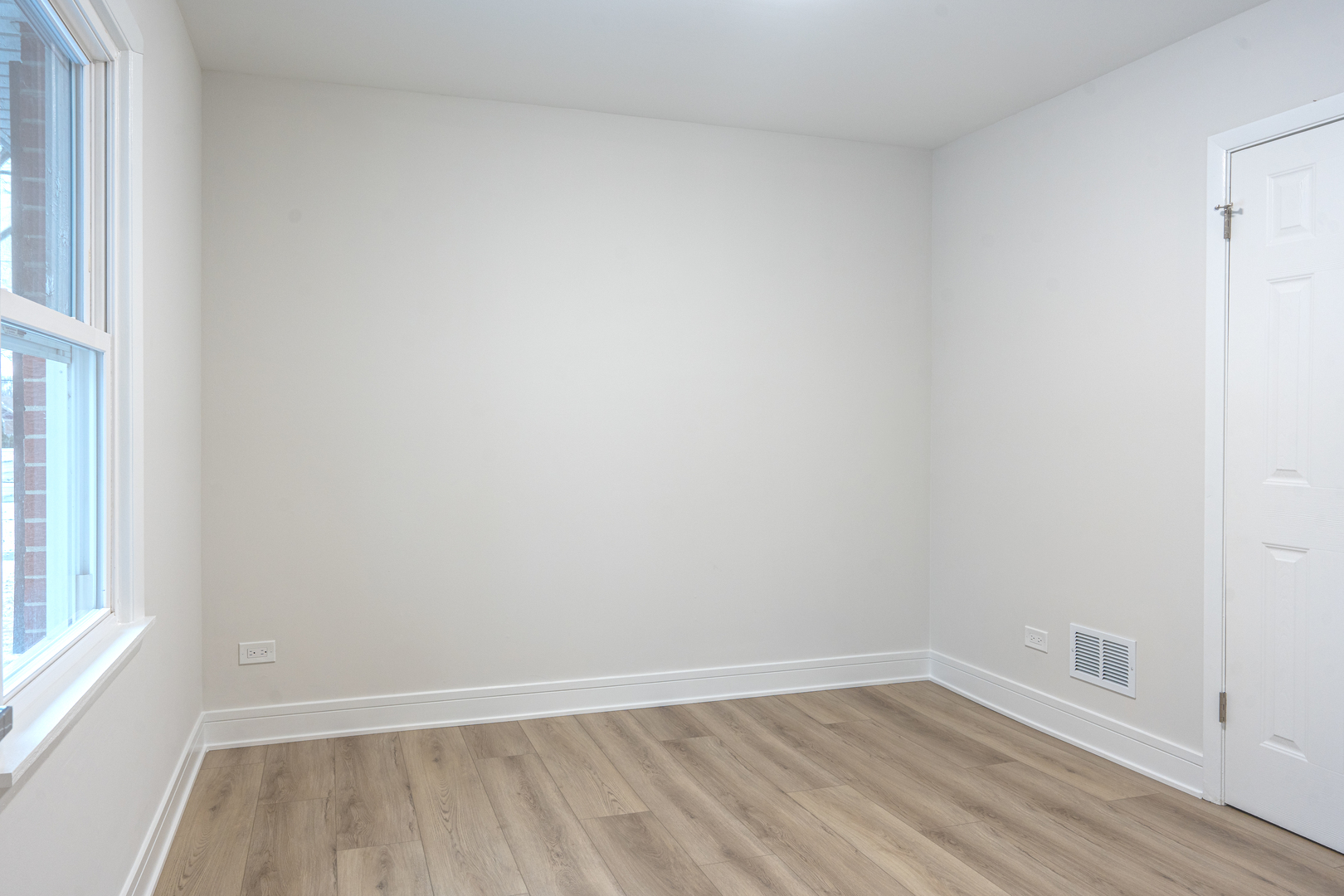 11 South Alfred Avenue Elgin, IL 60123 - Photo 8 of 22 wooden floor in an empty room