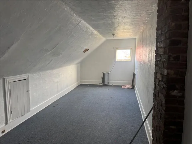 a view of a hallway to an empty room
