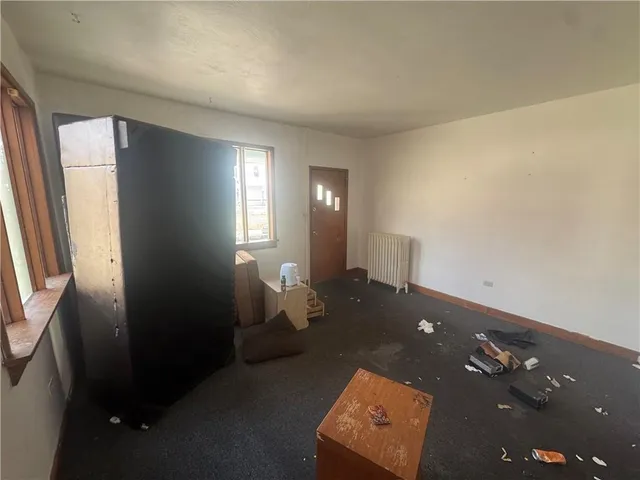 wooden floor in a room next to a window