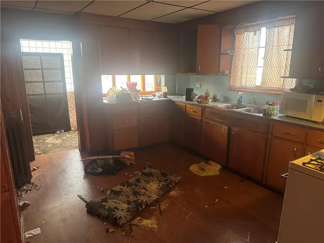 a kitchen with a sink and cabinets