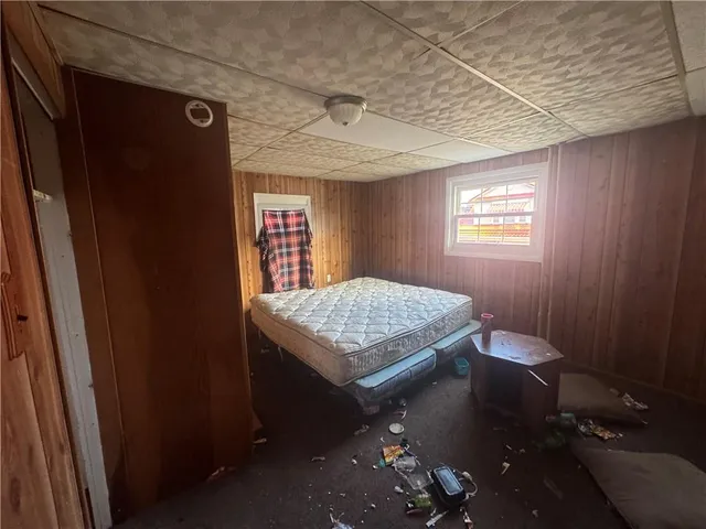 a living room with pool table and windows