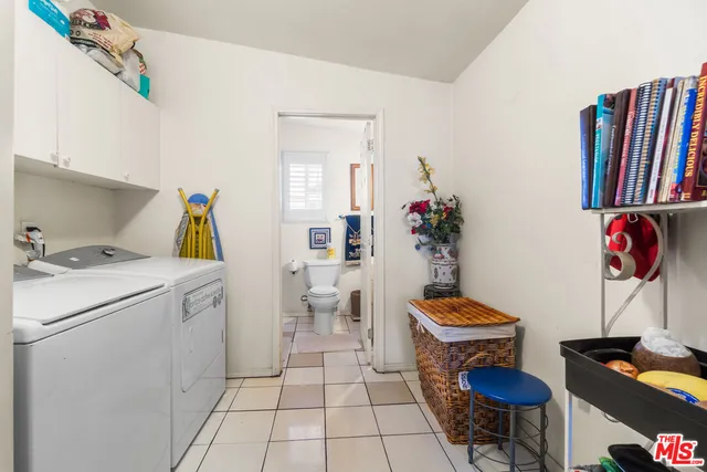 a bathroom with a toilet a sink and a shower