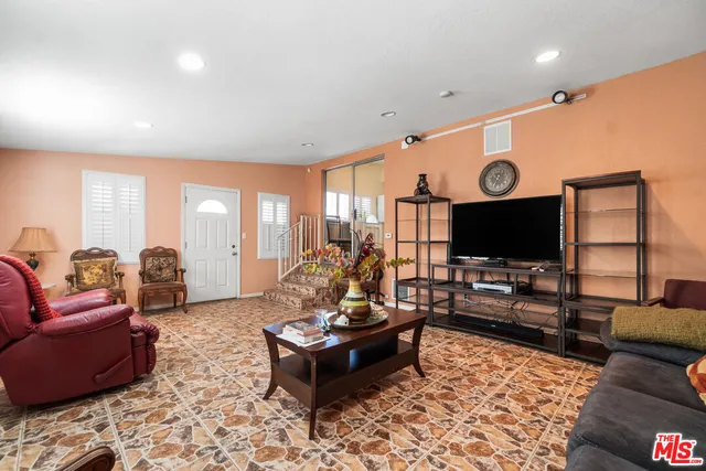 a view of a hallway with windows and dual walls