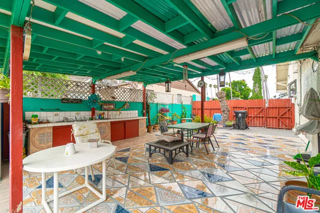 an aerial view of residential houses with outdoor space and street view