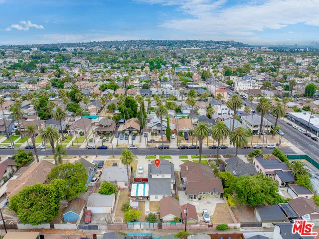 a view of swimming pool with outdoor seating and city view
