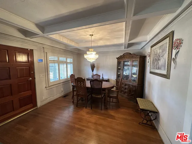 a view of a livingroom with furniture and a window