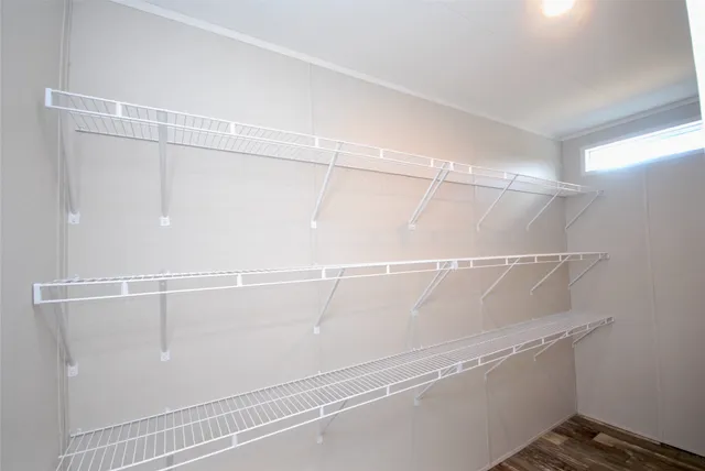 a view of a room with racks on the wall