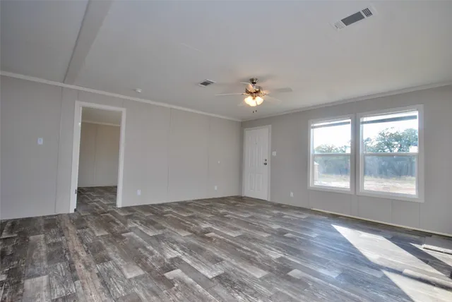 a view of an empty room with a window