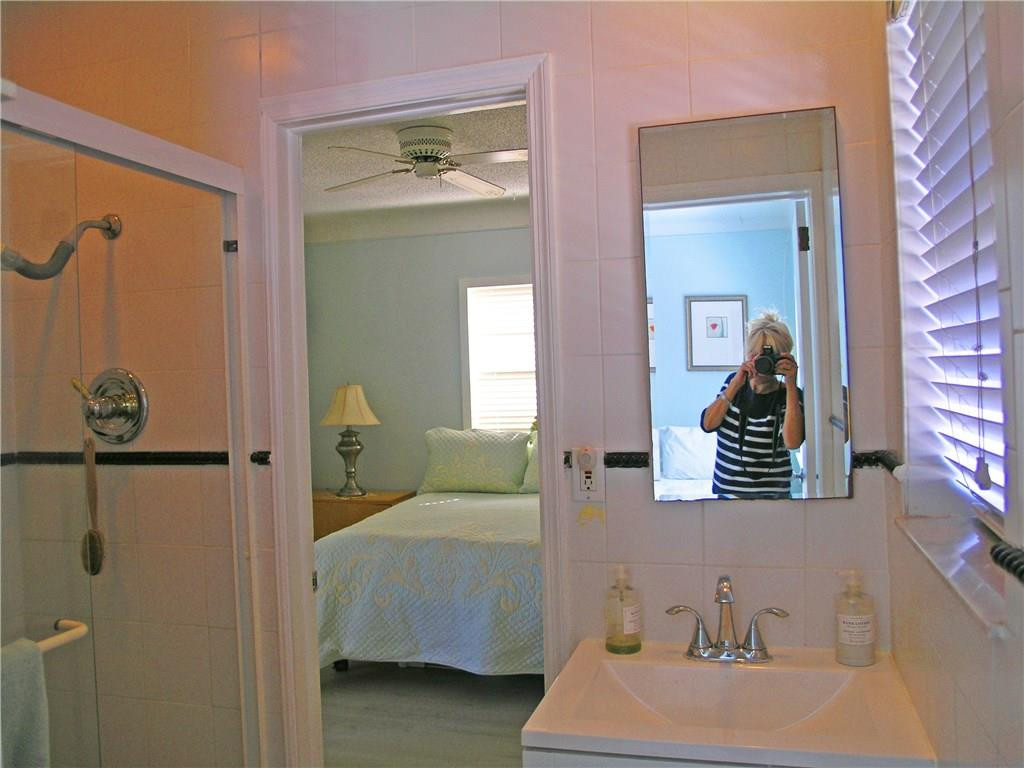 1910 North Surf Road, Unit 7 Hollywood, FL 33019 - Photo 11 of 17 a en suite bathroom with a sink and mirror