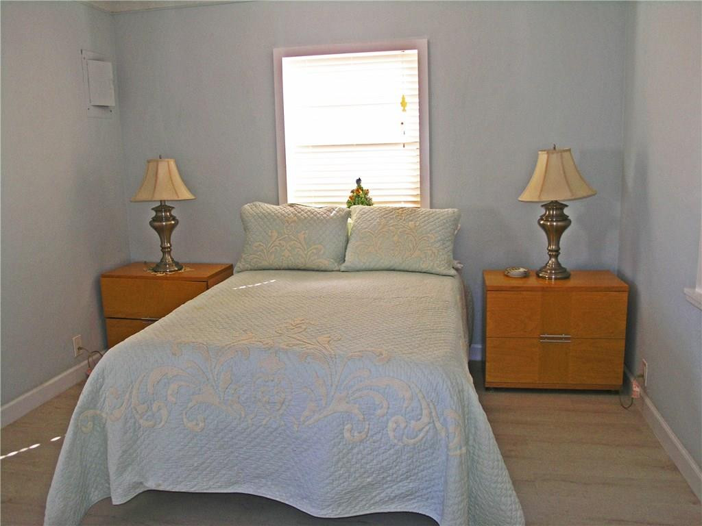 1910 North Surf Road, Unit 7 Hollywood, FL 33019 - Photo 12 of 17 a bed room with a bed and a table
