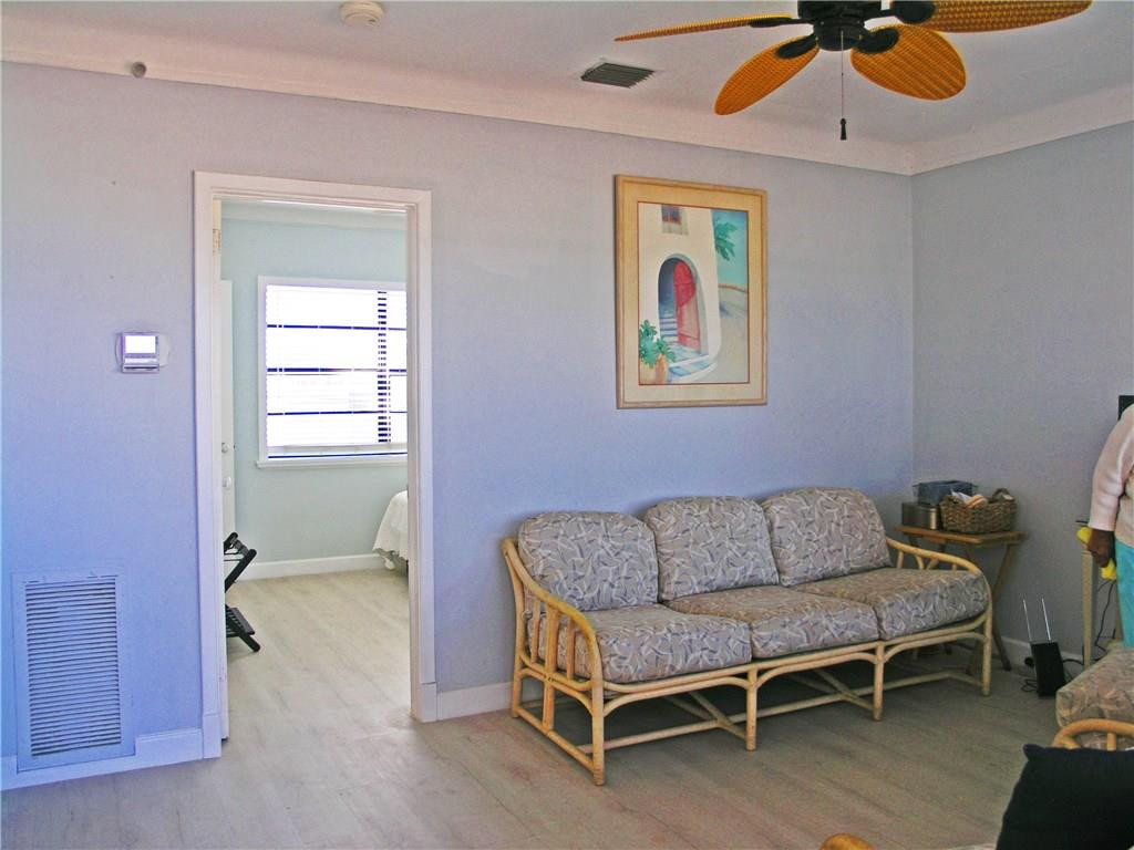 1910 North Surf Road, Unit 7 Hollywood, FL 33019 - Photo 13 of 17 a living room with furniture and a window