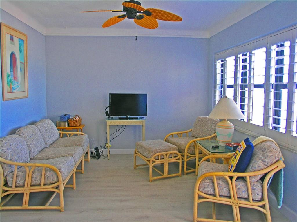 1910 North Surf Road, Unit 7 Hollywood, FL 33019 - Photo 5 of 17 a living room with furniture and a flat screen tv