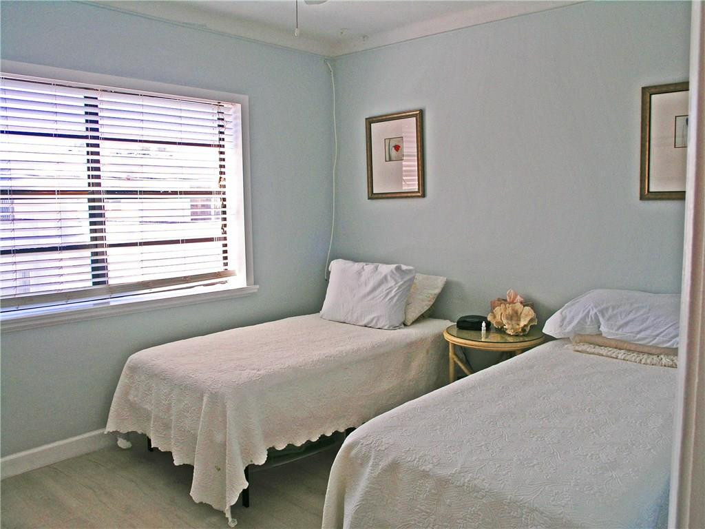 1910 North Surf Road, Unit 7 Hollywood, FL 33019 - Photo 6 of 17 a bedroom with two beds and a window