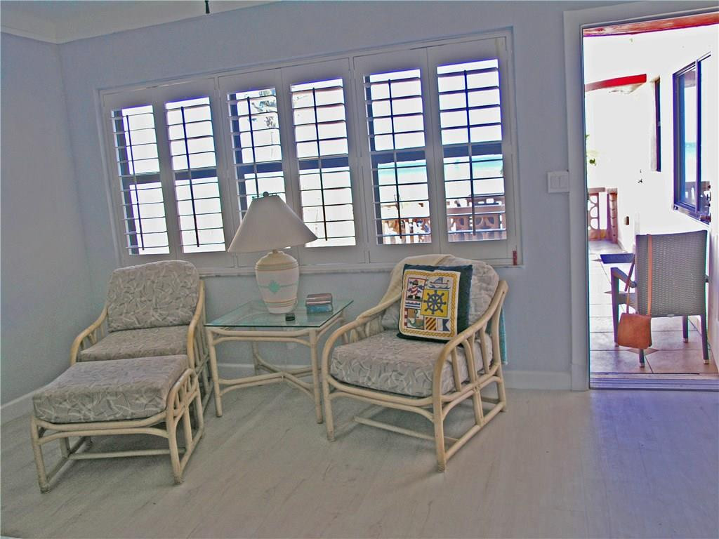 1910 North Surf Road, Unit 7 Hollywood, FL 33019 - Photo 10 of 17 a living room with furniture and a large window